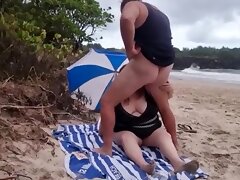 Blowjob on the beach with a very fat